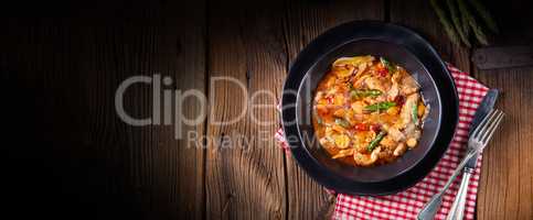 colorful turkey fricassee with asparagus and paprika