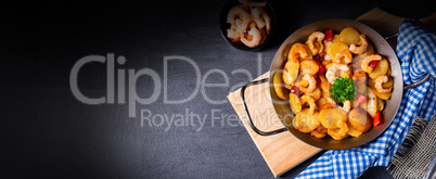 a delicious fried potato and shrimp pan