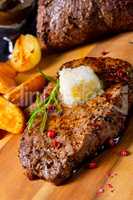 Butter Beef Steak with herbs and potato wedges