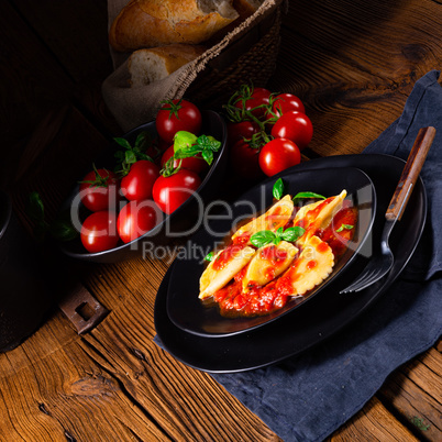 ravioli alla genovese with basil tomato sauce