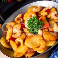 a delicious fried potato and shrimp pan