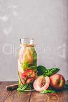 Detox Water with Peach and Basil.