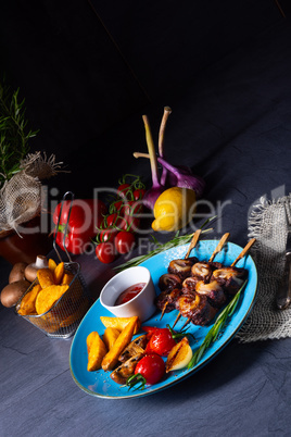 cattle shashlik skewers with grilled vegetables on a caucasian