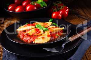 ravioli alla genovese with basil tomato sauce