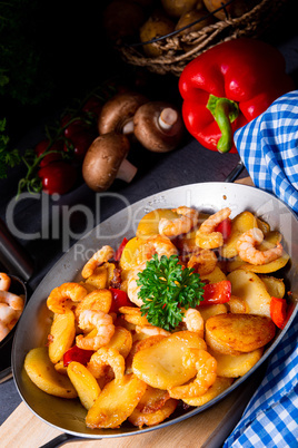 a delicious fried potato and shrimp pan