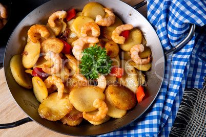 a delicious fried potato and shrimp pan