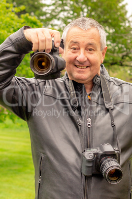 Photographer with two cameras at work