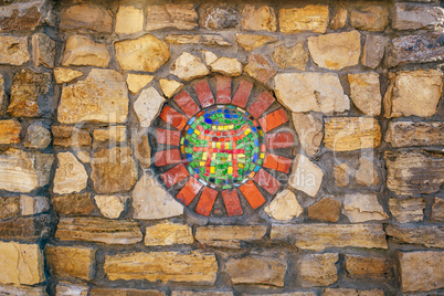 Mosaic symbol of Shinto on wall.