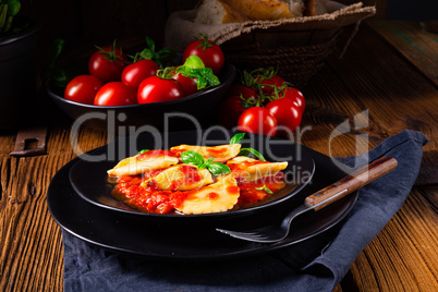 ravioli alla genovese with basil tomato sauce