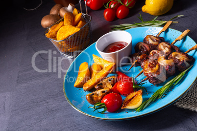 cattle shashlik skewers with grilled vegetables on a caucasian