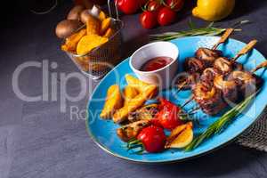 cattle shashlik skewers with grilled vegetables on a caucasian