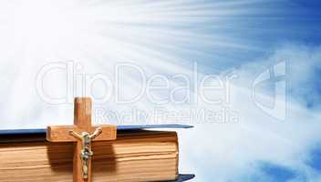 Book and a wooden cross