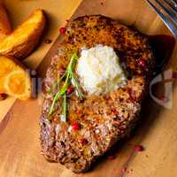 Butter Beef Steak with herbs and potato wedges