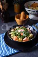pappardelle pasta with creamed spinach and fried salmon