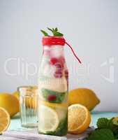 summer refreshing drink lemonade with lemons, cranberry, mint le