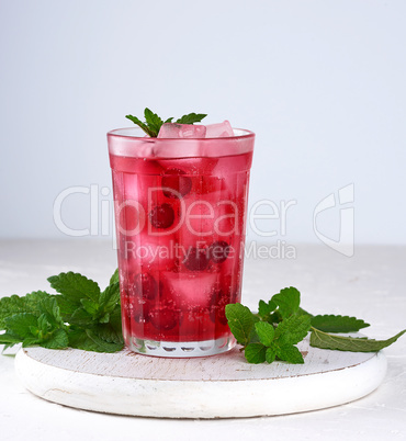 summer refreshing drink with berries of cranberries and pieces o