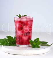 summer refreshing drink with berries of cranberries and pieces o