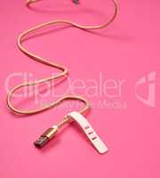 golden usb cable for charging with electricity equipment in text