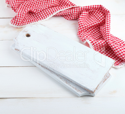 rectangular empty wooden cutting boards and red towel