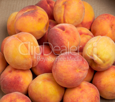 heap of ripe yellow-red round peaches