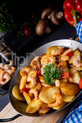 a delicious fried potato and shrimp pan