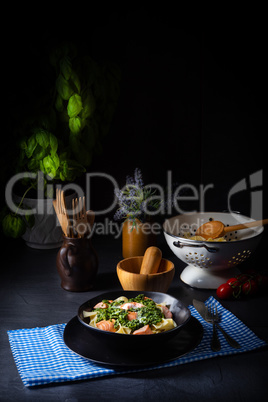 pappardelle pasta with creamed spinach and fried salmon