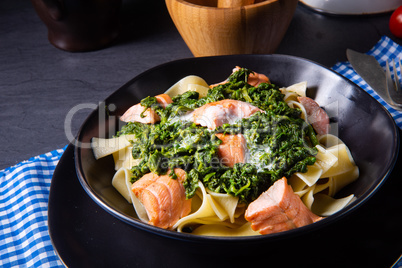 pappardelle pasta with creamed spinach and fried salmon