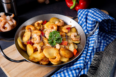 a delicious fried potato and shrimp pan