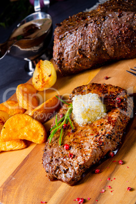 Butter Beef Steak with herbs and potato wedges