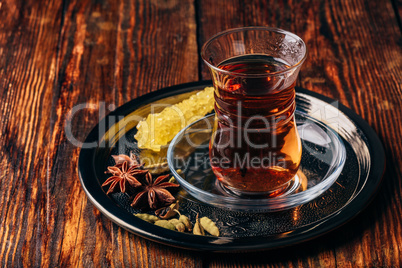 Spiced tea in armudu with crystal sugar