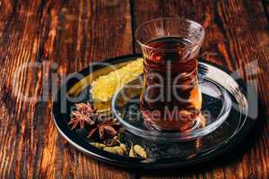 Spiced tea in armudu with crystal sugar