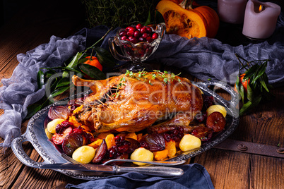 roast duck with potato dumplings and plums