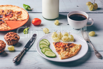 Breakfast frittata with with coffee, grapes and muffins.