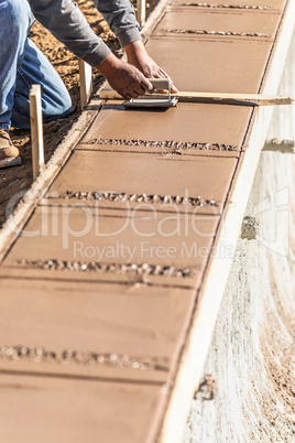 Construction Worker Using Hand Groover On Wet Cement Forming Cop