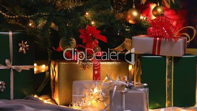 Christmas gifts near Christmas tree and fireplace