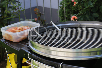 Meat and sausages are fried on the grill