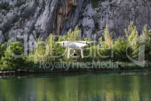 Drone flies low above water on lake