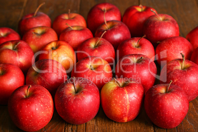 Beautiful red apples are on the table