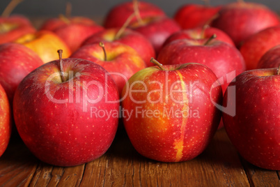 Beautiful red apples are on the table