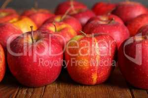 Beautiful red apples are on the table