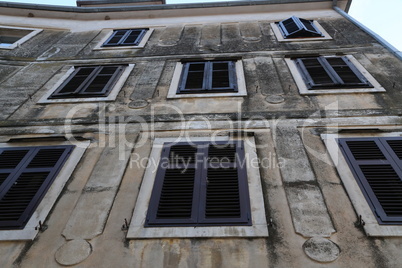 Shuttered windows - Old houses with shuttered windows