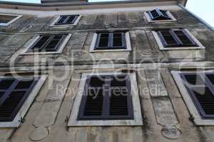 Shuttered windows - Old houses with shuttered windows