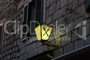 Old street lamps illuminate the way for passersby