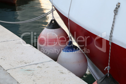 Mooring fender hangs on a boat, close-up