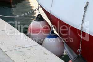 Mooring fender hangs on a boat, close-up