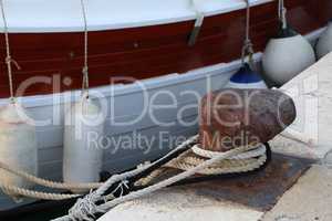 Bollard with a mooring line wrapped around it