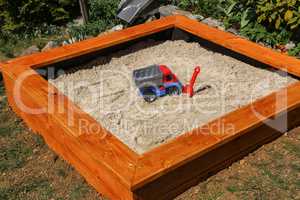 Newly built sandbox for small children in the garden