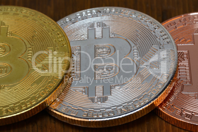 Cryptocurrency. Bitcoins are on the wooden table