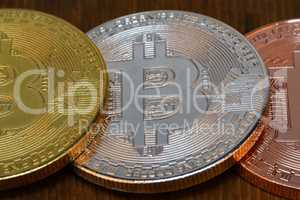 Cryptocurrency. Bitcoins are on the wooden table