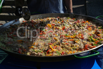 A dish of rice, vegetables and meat